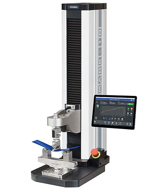 F755S bendfixture intellimesur: A UTM is applying a compression load to a material.