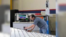 AMRO Quality Engineer Rodrigo Delgadillo inspecting flat machined grid panel wall thicknesses before forming using Verisurf inspection software and Leica laser tracker with wireless T-Probe. 